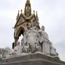 Marble statues at the corner of the Albert Memorial, with its Gothic canopy behind