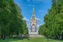 The Albert Memorial at the end of a tree-lined lawn in Kensington Gardens