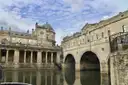 Pulteney Bridge over the River Avon in Bath, beside a stone colonnade