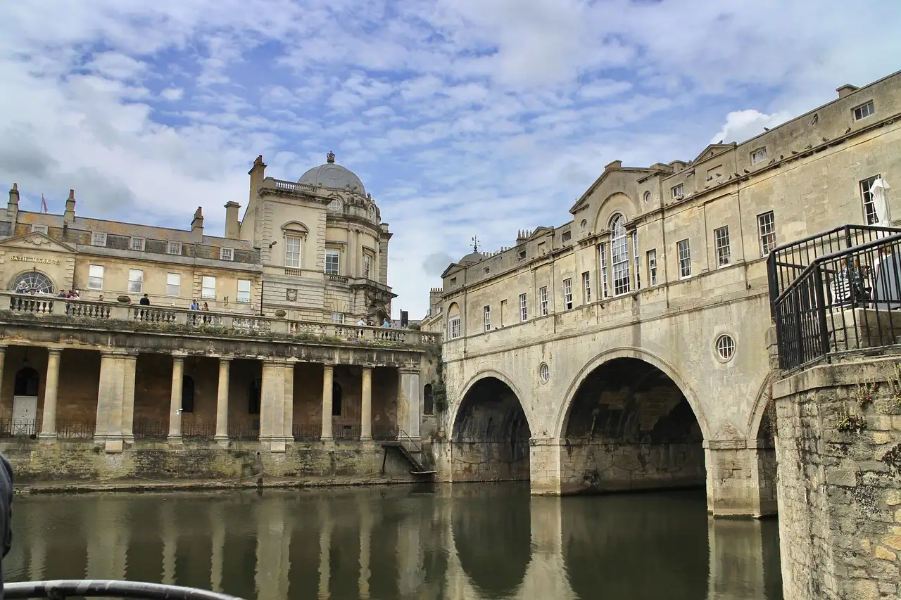 Pulteney Bridge over the River Avon in Bath, beside a stone colonnade