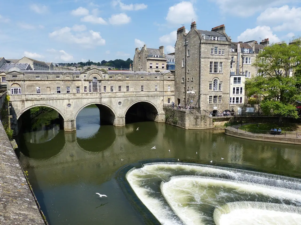 Pulteney Bridge in Bath above the curved weir on the River Avon
