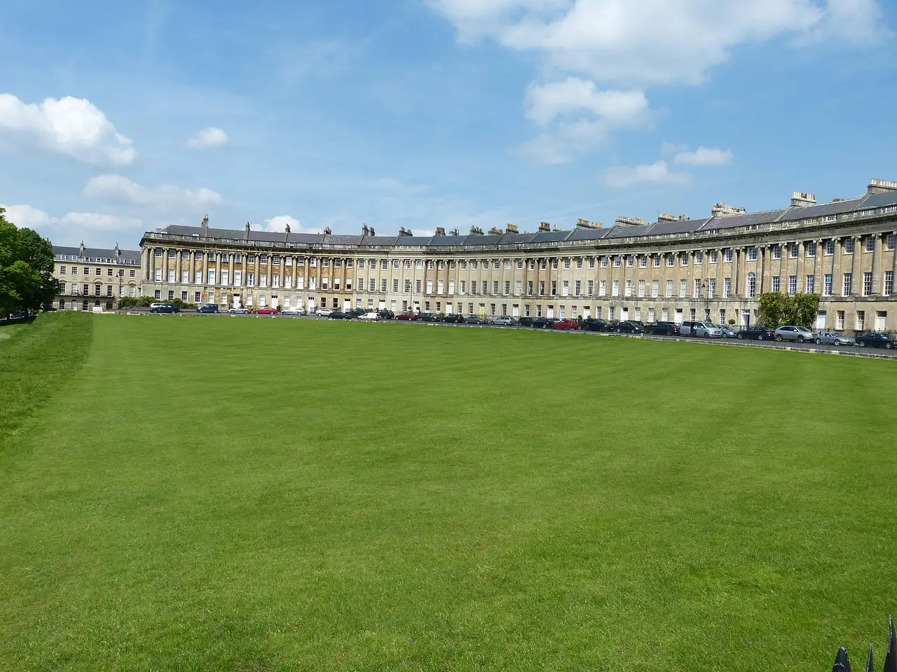 The curved Georgian terrace of the Royal Crescent in Bath behind a wide lawn