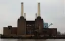 Battersea Power Station and its white chimneys, seen across the Thames