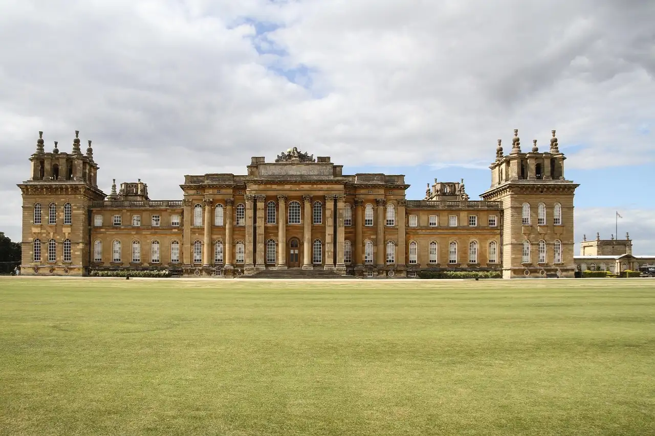 Blenheim Palace's baroque front behind a wide green lawn