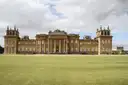 Blenheim Palace's baroque front behind a wide green lawn
