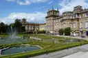 Blenheim Palace from its water terraces, with fountains and clipped hedges