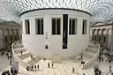 British Museum Great Court with its glass lattice roof around the round Reading Room