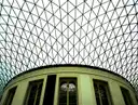 The glass lattice roof of the British Museum's Great Court above the round Reading Room