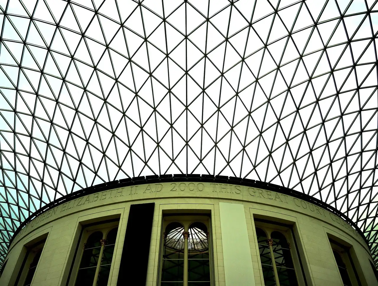 The glass lattice roof of the British Museum's Great Court above the round Reading Room