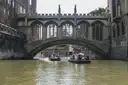 Punts passing under the Bridge of Sighs in Cambridge