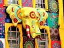 A giant painted elephant head on a colourful shopfront in Camden High Street