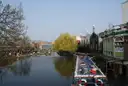 The Regent's Canal at Camden Lock, with a moored narrowboat and a weeping willow