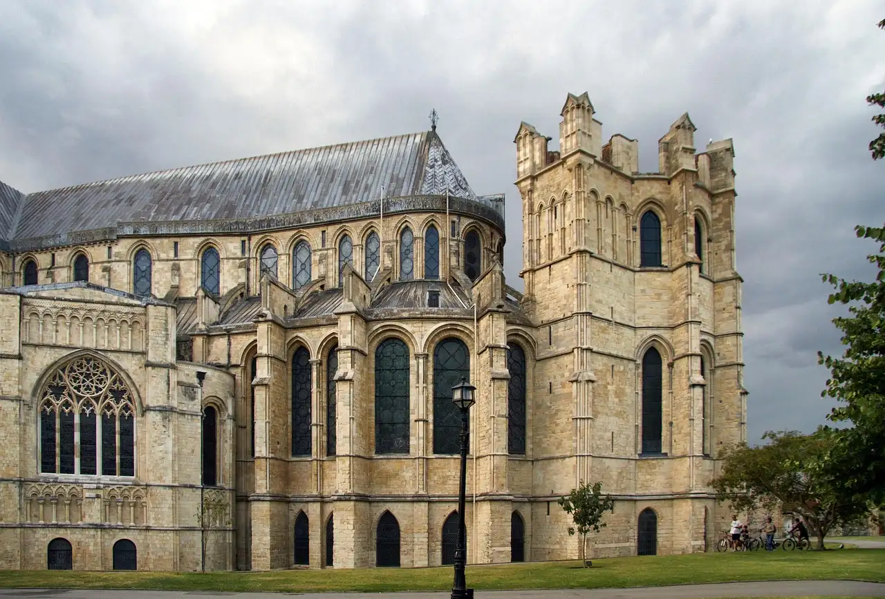 Canterbury Cathedral's stone towers and east end under a cloudy sky
