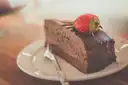 Slice of layered chocolate cake on a plate