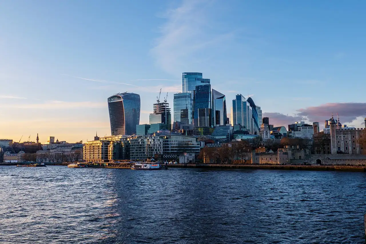 The City of London skyline seen across the River Thames in evening light