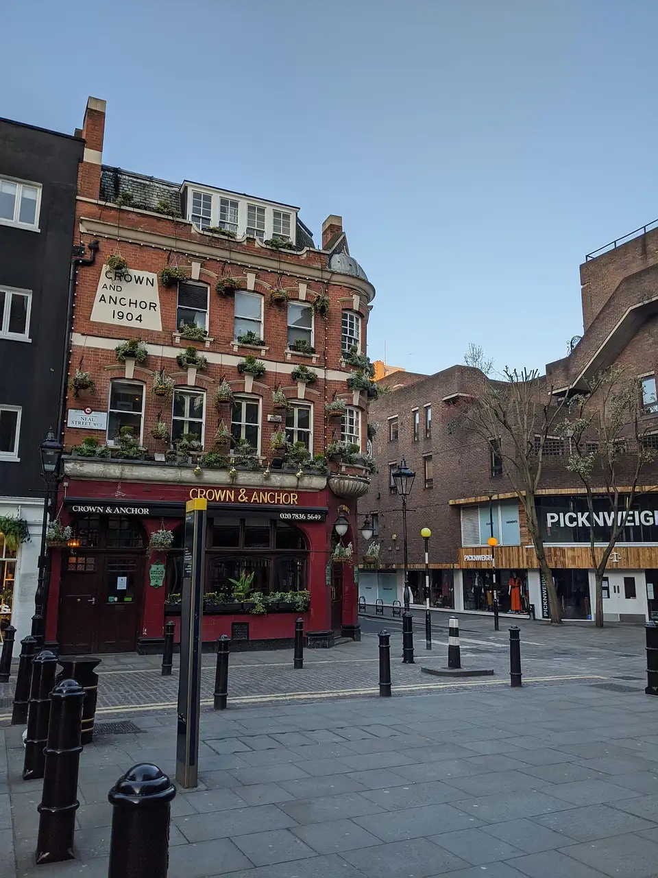 The red-brick Crown and Anchor pub at Seven Dials in Covent Garden, with flower boxes on every window