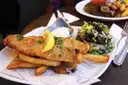 Plate of battered fish and chips