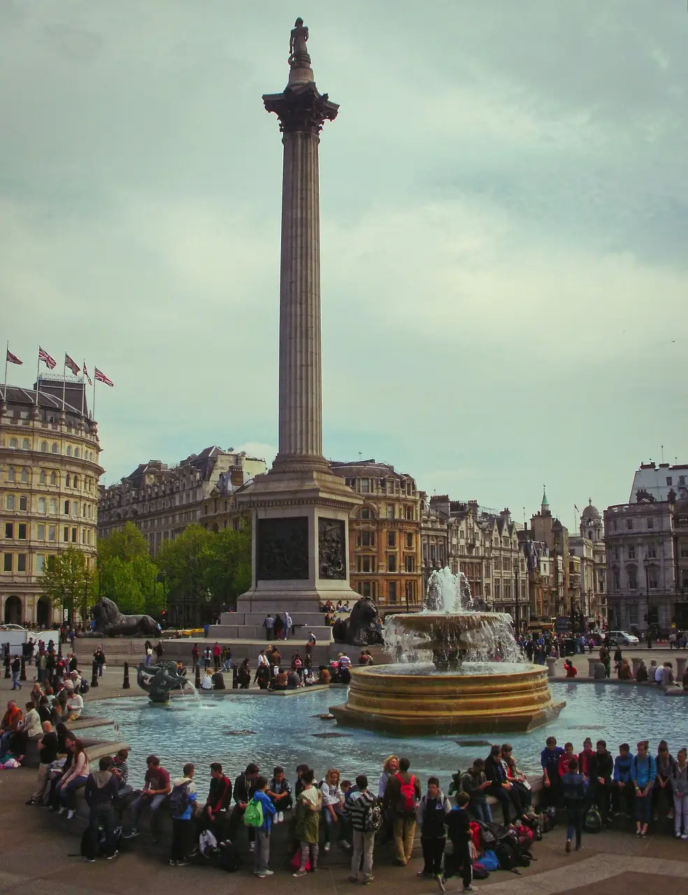 Nelson's Column rising above the fountains and crowds of Trafalgar Square