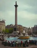 Nelson's Column rising above the fountains and crowds of Trafalgar Square