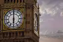 Close-up of the golden clock face of Big Ben with its black hands and Roman numerals