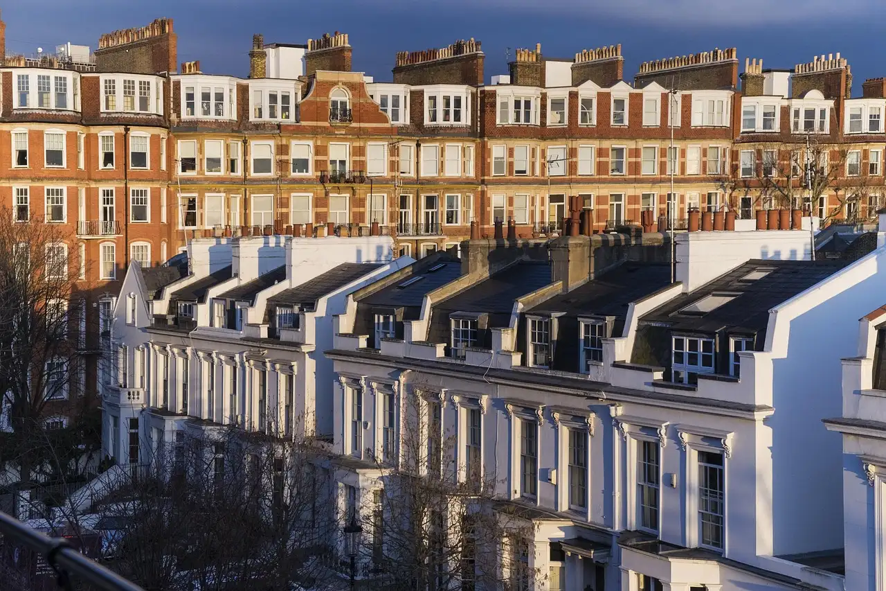 White stucco terraced houses and red-brick mansion blocks in Kensington