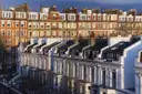 White stucco terraced houses and red-brick mansion blocks in Kensington