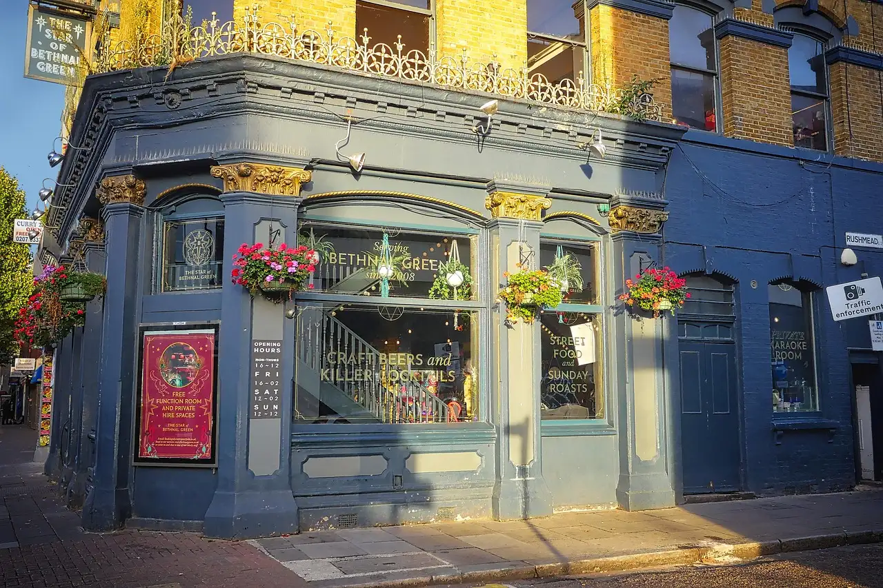 A Victorian corner pub in London with hanging flower baskets