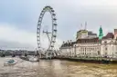 The London Eye next to County Hall, seen across the River Thames