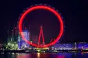 The London Eye glowing as a red ring at night