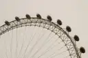 The curved rim of the London Eye with its capsules, seen from below