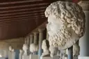A carved marble head in a sculpture gallery
