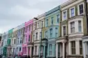 Row of colourful terraced houses along a Notting Hill street