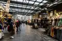 Clothes stalls under the glass roof of Old Spitalfields Market