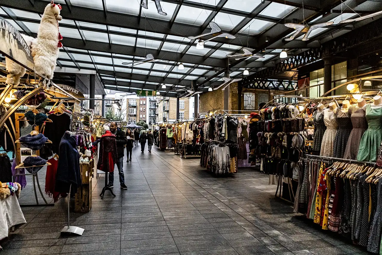 Clothes stalls under the glass roof of Old Spitalfields Market