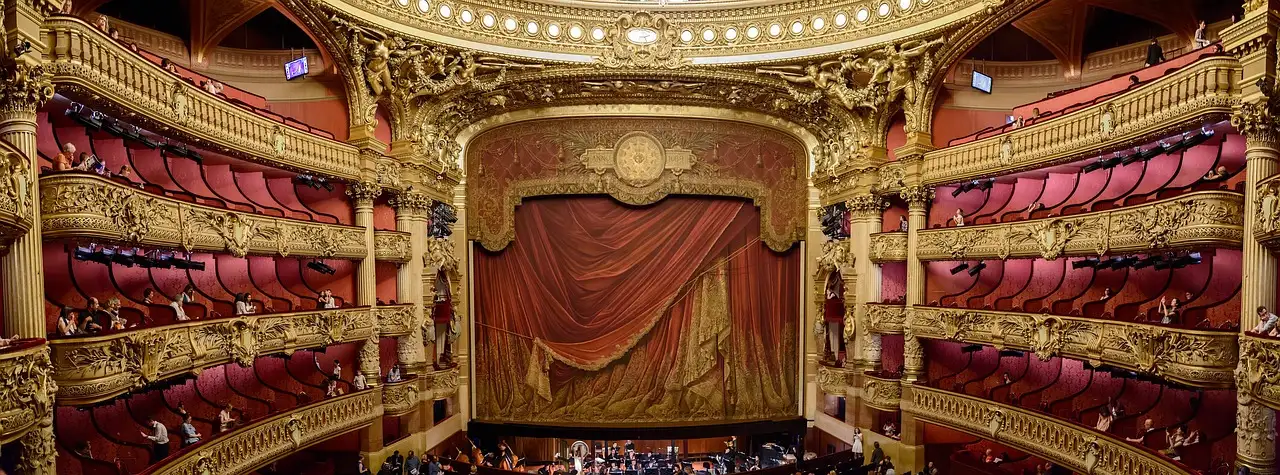 A gilded opera-house auditorium with tiers of boxes around the stage