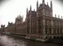 Gothic river front of the Palace of Westminster beside the Thames