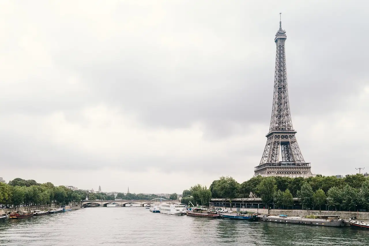 River Seine in Paris with the Eiffel Tower rising above the trees