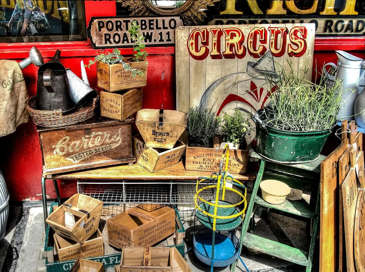 Market stall with vintage crates, tins and plants on Portobello Road