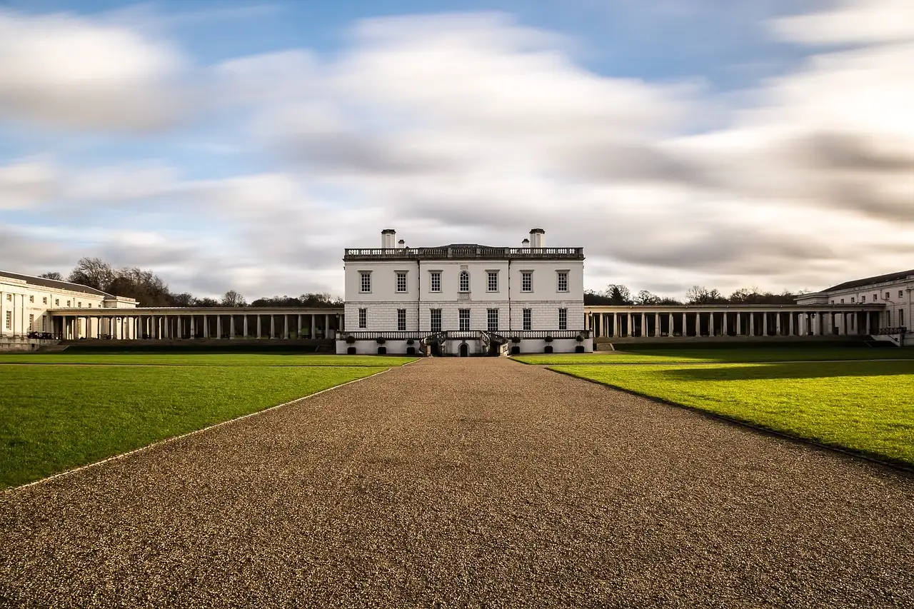 The white Queen's House in Greenwich at the end of a gravel path