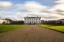The white Queen's House in Greenwich at the end of a gravel path