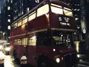 A vintage red Routemaster bus on route 15 to Tower Hill at night