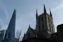 Southwark Cathedral's tower at dusk, with the Shard beside it