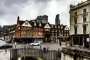 Victorian buildings at a street corner in Spitalfields, East London, under grey skies