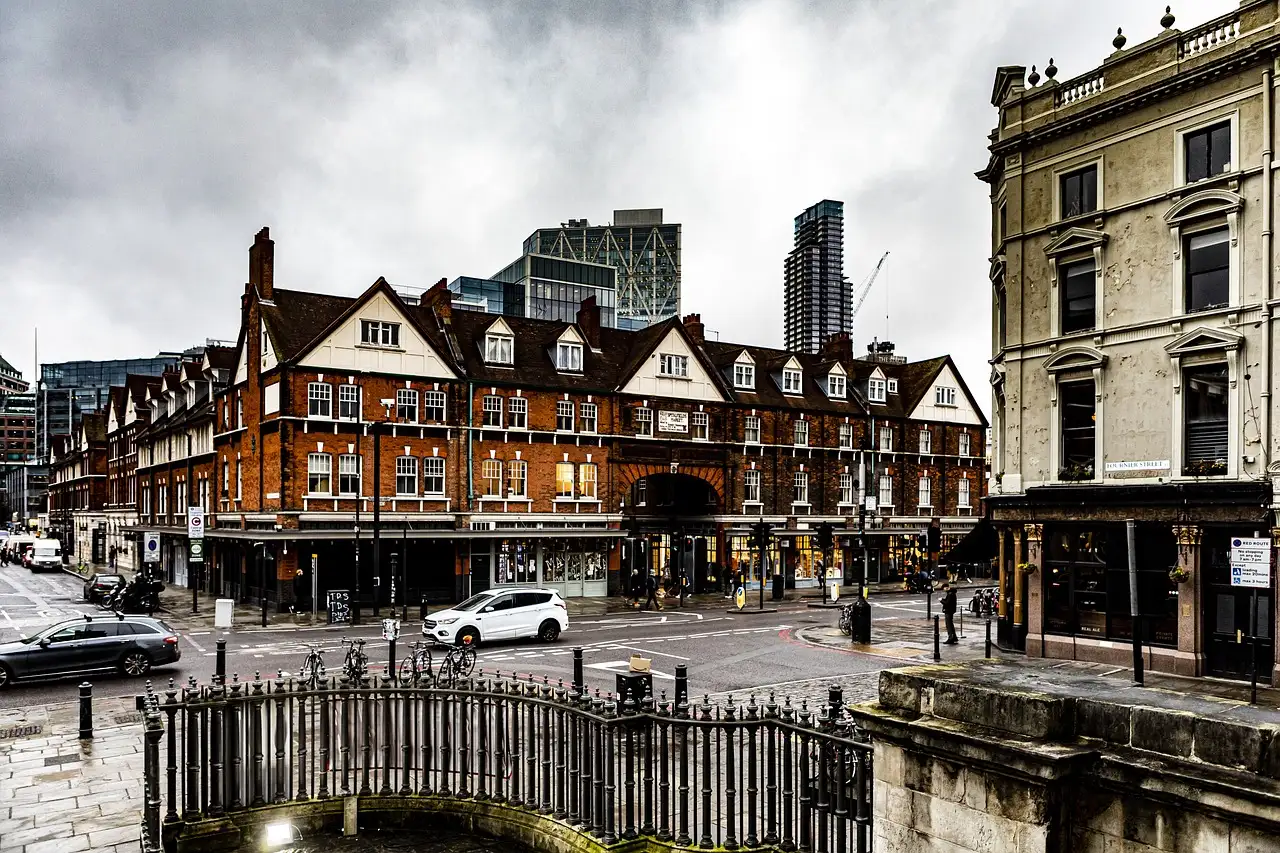 Victorian buildings at a street corner in Spitalfields, East London, under grey skies