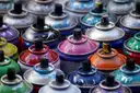 Rows of colourful spray-paint cans