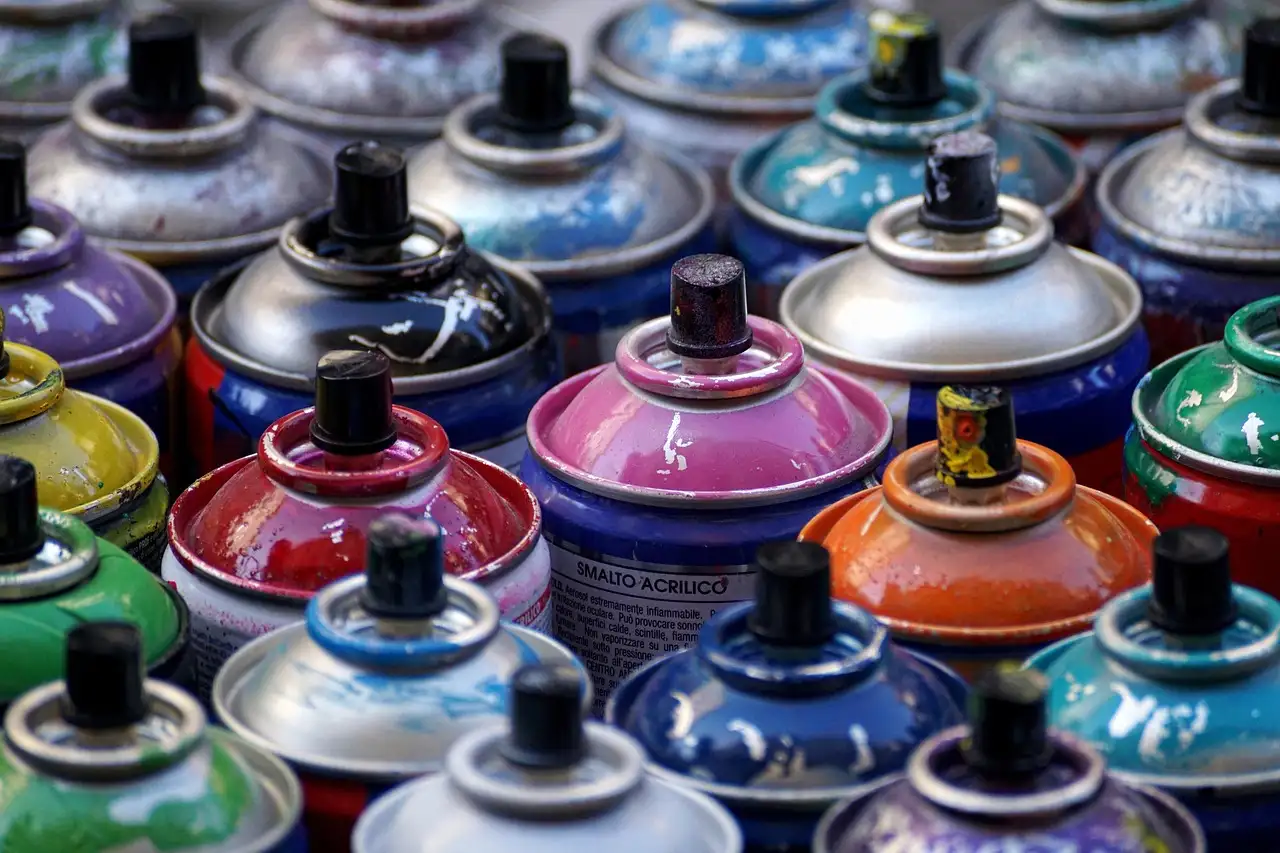 Rows of colourful spray-paint cans