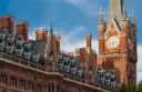 The red-brick gothic front and clock tower of St Pancras station, next to King's Cross