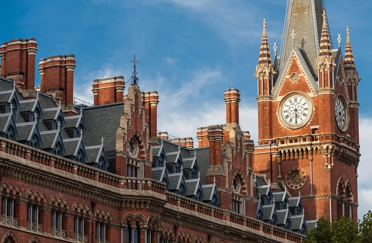 The red-brick gothic front and clock tower of St Pancras station, next to King's Cross