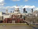 St Paul's Cathedral seen across the River Thames under white clouds
