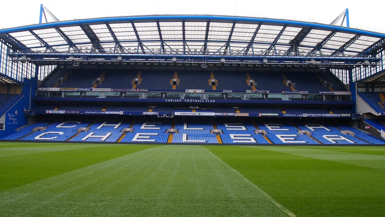 The blue stands of Stamford Bridge seen across the empty pitch